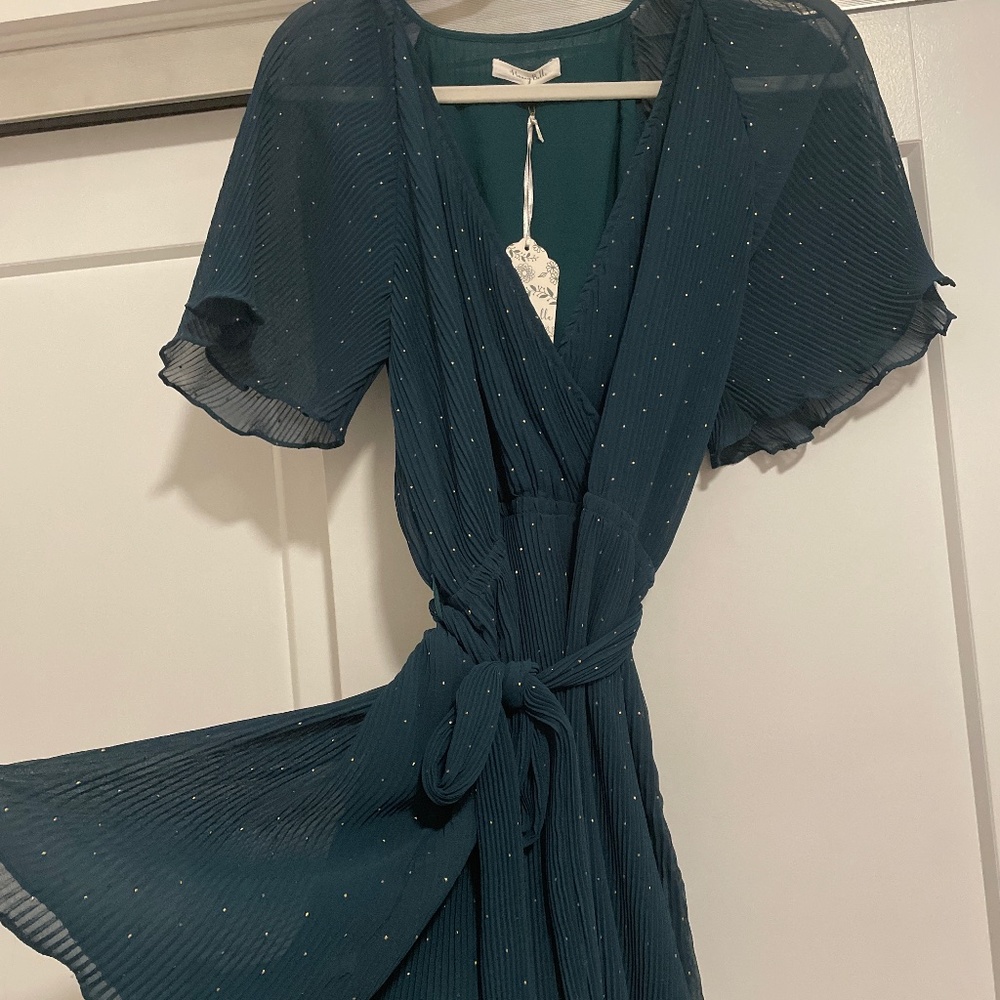 Dark green play suit with tag